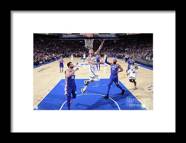 Rodions Kurucs Framed Print featuring the photograph Brooklyn Nets V Philadelphia 76ers - by Jesse D. Garrabrant