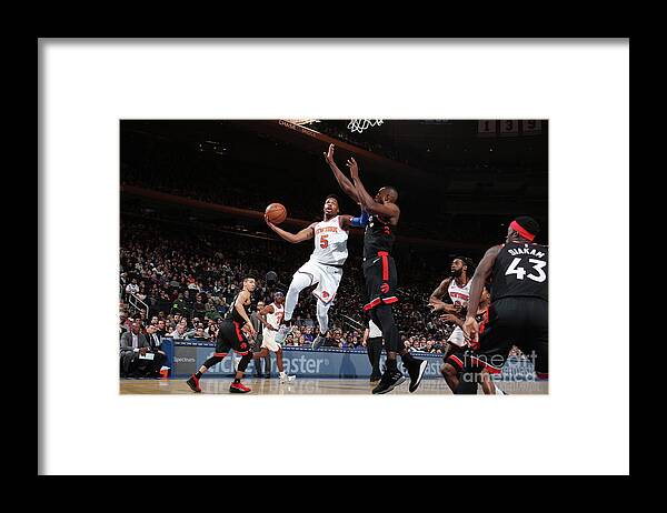 Dennis Smith Jr Framed Print featuring the photograph Toronto Raptors V New York Knicks by Nathaniel S. Butler