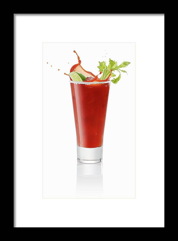 Ip_11263000 Framed Print featuring the photograph A Bloody Mary Splashing Out Of The Glass by Krger & Gross