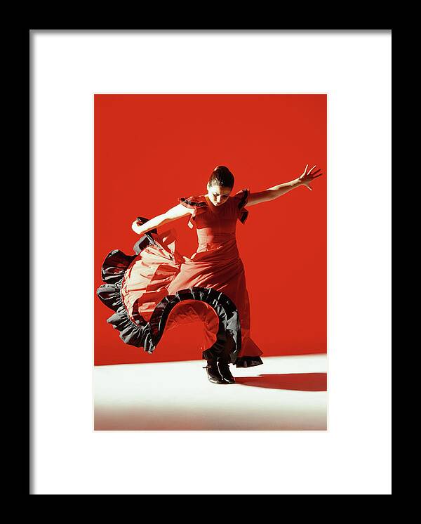 Ballet Dancer Framed Print featuring the photograph A Female Flamenco Dancer Performing A by George Doyle