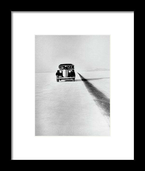 People Framed Print featuring the photograph A Ford Lincoln On The Bonneville Salt by Heritage Images