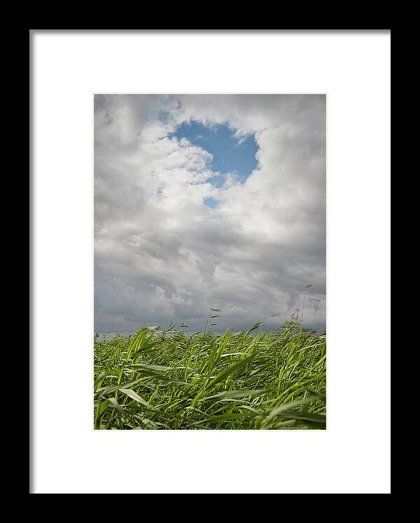 Green Color Framed Print featuring the digital art A Hole In The Clouds In The Frisian Lake District, Sneek, Friesland, Netherlands by Mischa Keijser