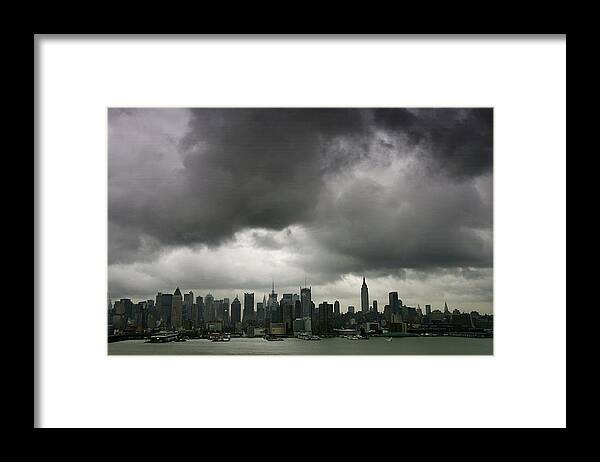 Natural Gas Framed Print featuring the photograph A Low Layer Of Dark Clouds Hangs Over by New York Daily News Archive
