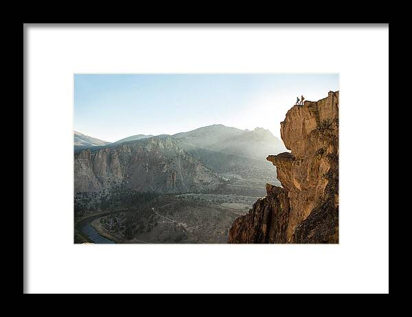Young Men Framed Print featuring the photograph A Man And Woman Hiking by Jordan Siemens