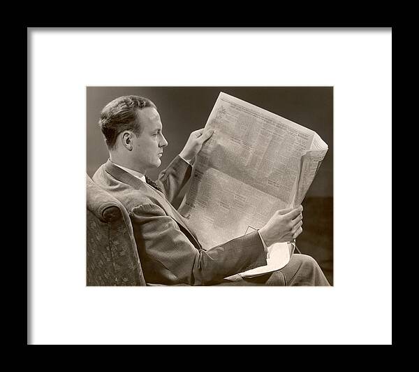 One Man Only Framed Print featuring the photograph A Man Reads A Newspaper by George Marks