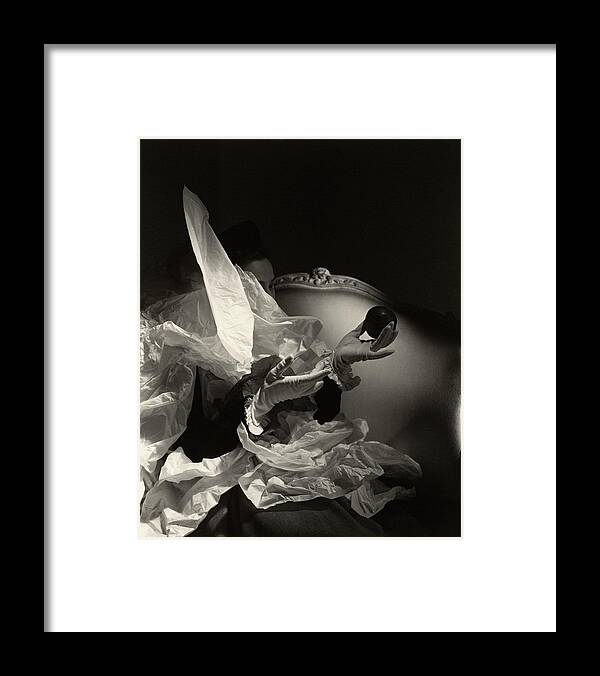 #new2022vogue Framed Print featuring the photograph A Pair Of Hands In Gloves Holding An Apple by Horst P Horst