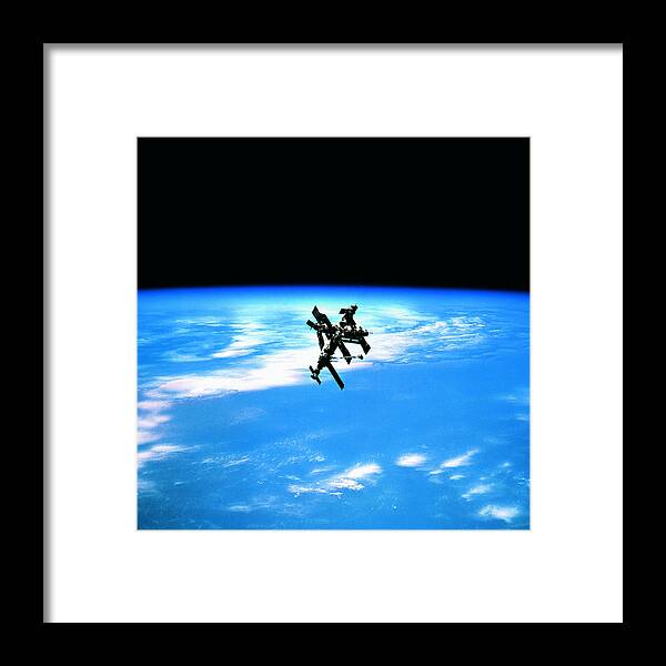 Research Framed Print featuring the photograph A Space Station In Orbit Above Earth by Stockbyte