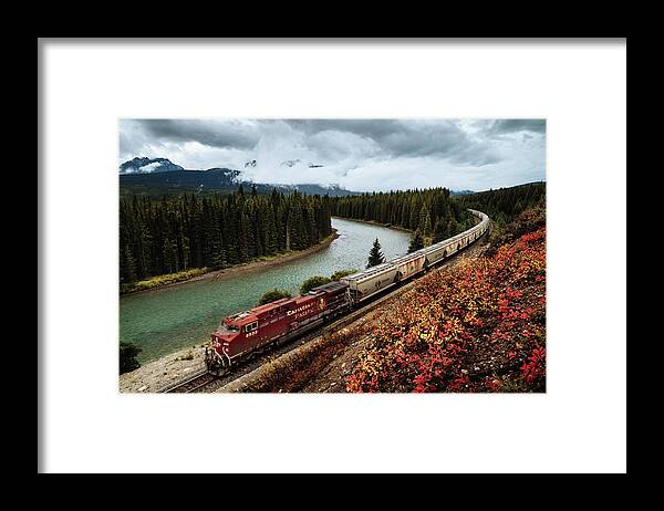  Framed Print featuring the photograph A train in the Banff National Park in Canada by Kamran Ali