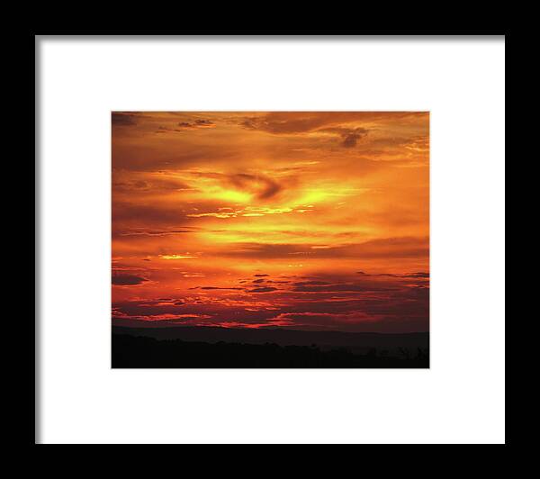 Majestic Framed Print featuring the photograph A Vivid Orange And Red Sunset Over by Jlfcapture