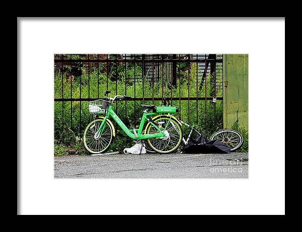 Electric-assist Bicycle Framed Print featuring the photograph A Welcome Splash of Lime on a Wet and Windy Day by Steve Ember