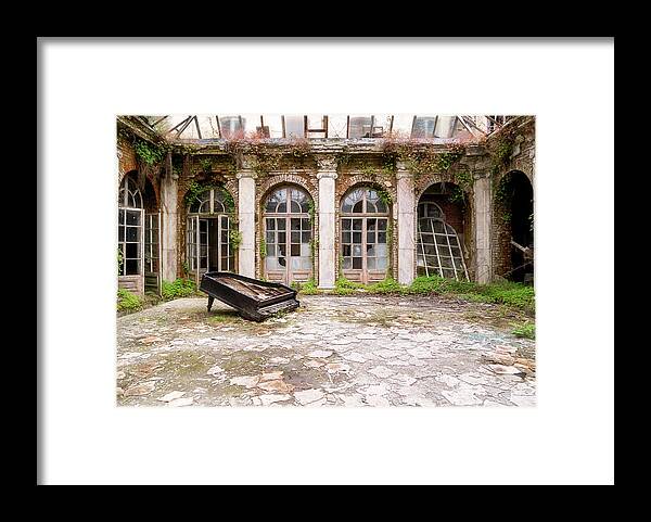 Urban Framed Print featuring the photograph Abandoned Piano in Courtyard by Roman Robroek