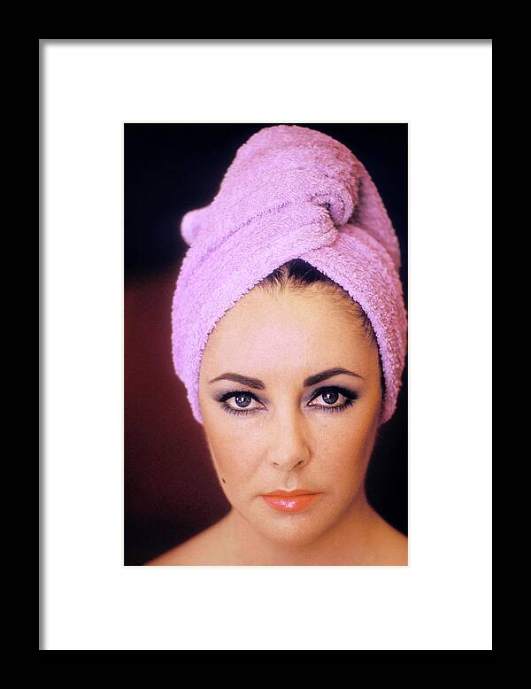 Elizabeth Taylor Framed Print featuring the photograph Actress Elizabeth Taylor Poses by Getty Images