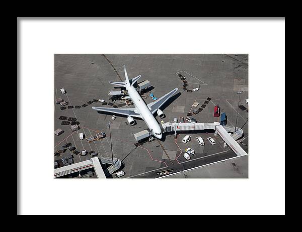 Airport Departure Area Framed Print featuring the photograph Airplane At The Gate, Aerial View by Dan prat