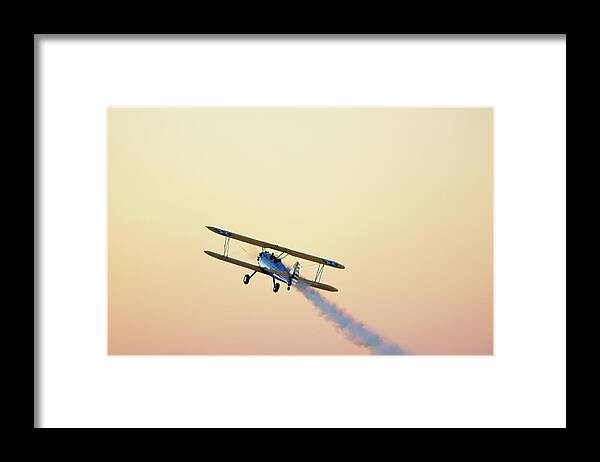 Performance Framed Print featuring the photograph Airshow Smoke Trail At Sunset by Jim Mckinley
