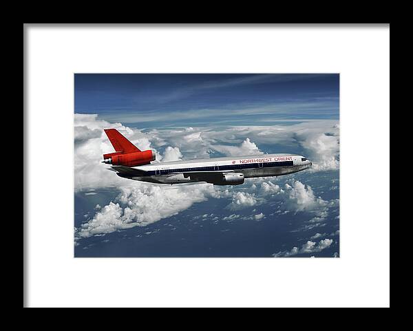 Northwest Orient Airlines Framed Print featuring the mixed media Among the Clouds - Northwest Orient DC-10-40 by Erik Simonsen