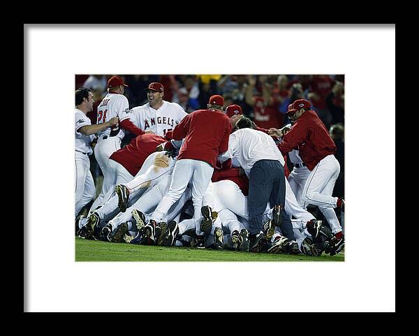 Los Angeles Angels Of Anaheim Framed Print featuring the photograph Angels Celebrate by Al Bello