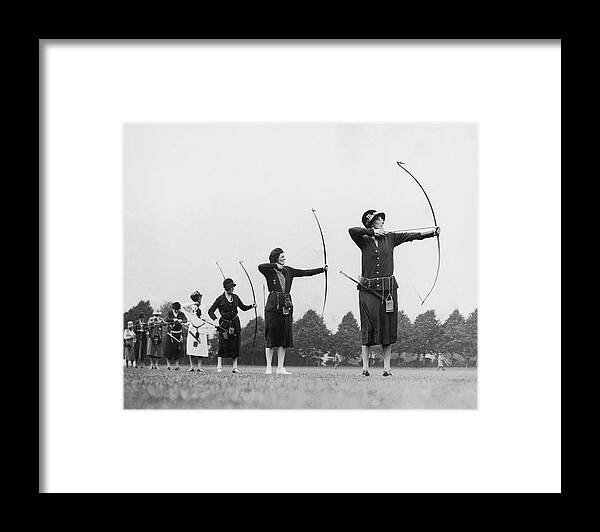 Mid Adult Women Framed Print featuring the photograph Archive Shot Row Of Female Archers by Fpg