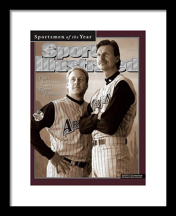 Magazine Cover Framed Print featuring the photograph Arizona Diamondbacks Curt Schilling And Randy Johnson, 2001 Sports Illustrated Cover by Sports Illustrated