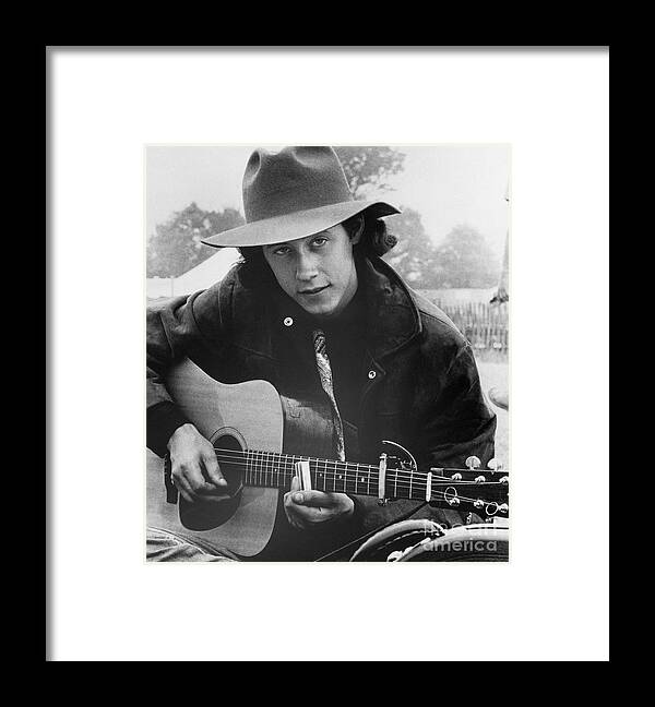 Young Men Framed Print featuring the photograph Arlo Guthrie With His Guitar by Bettmann