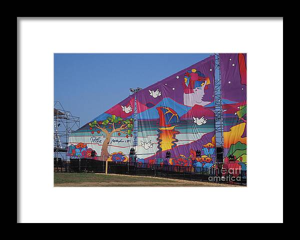 Artwork By Peter Max Is Shown On Display Covering The Stage Woodstock 99 In Rome Framed Print featuring the photograph Artwork by Peter Max by Concert Photos
