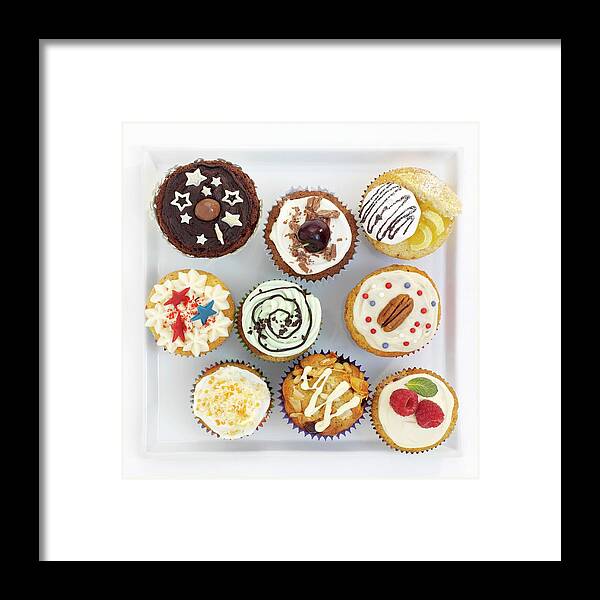 Ip_11169026 Framed Print featuring the photograph Assorted Decorated Cupcakes On A Square Plate by Garlick, Ian
