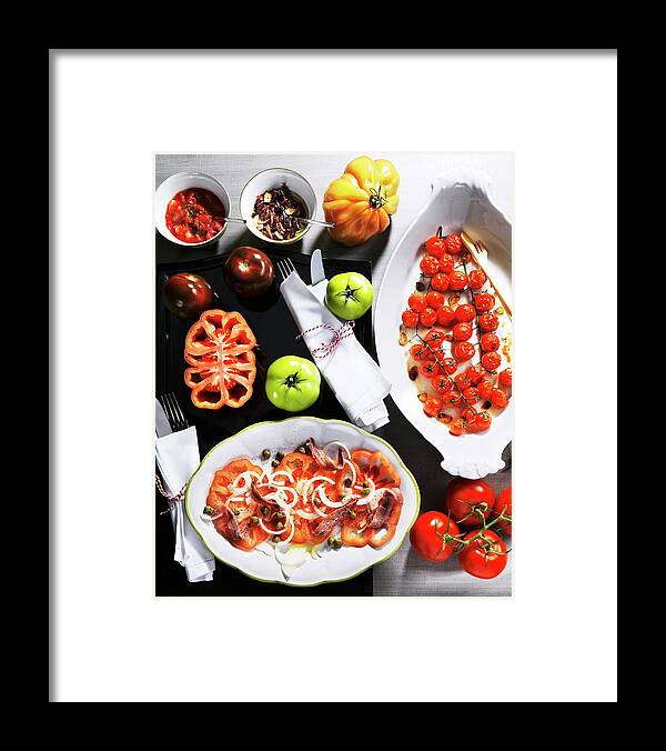 Ip_11184394 Framed Print featuring the photograph Assorted Tomato Dishes And Fresh Tomatoes by Landler/keppler