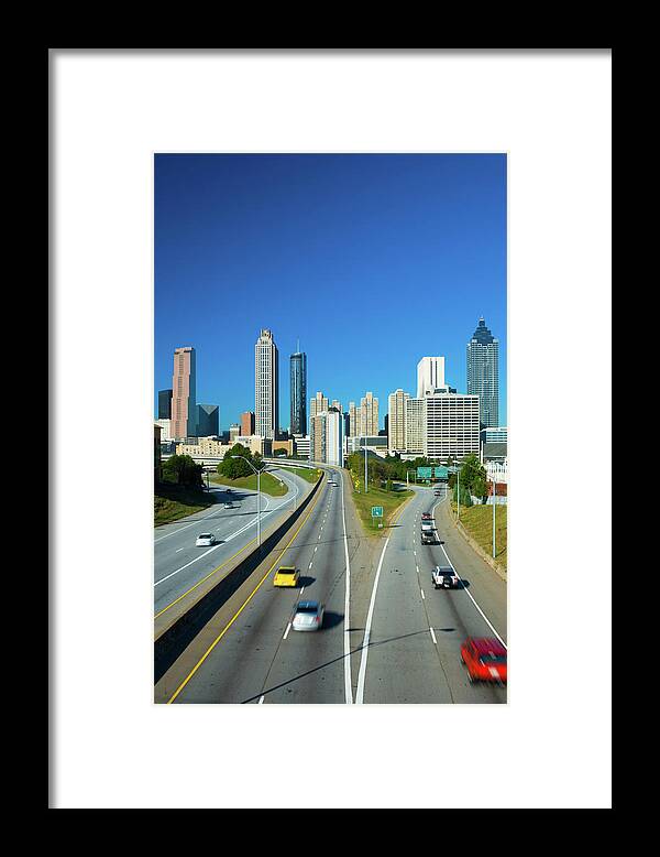 Atlanta Framed Print featuring the photograph Atlanta Skyline And Highway by Davel5957
