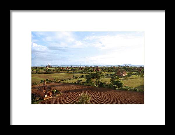 Pagoda Framed Print featuring the photograph Bagan Temples And Plowed Fields W Blue by Volanthevist