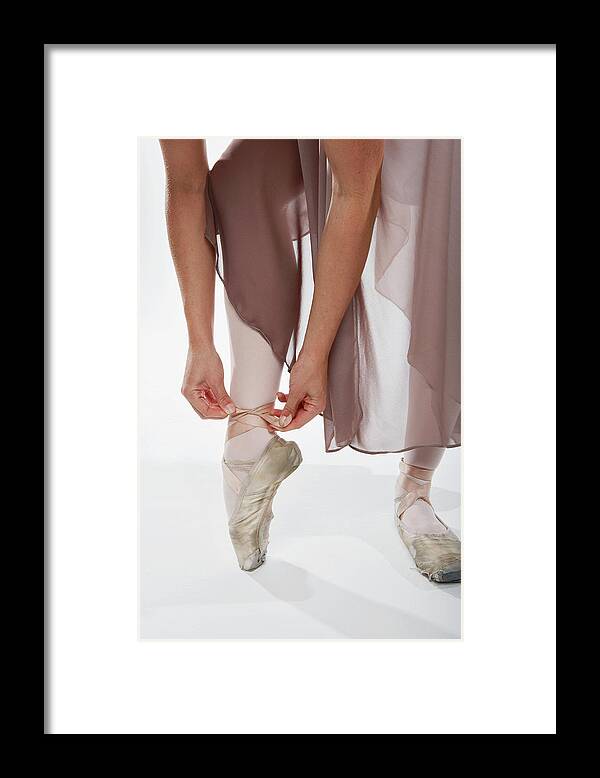 Ballet Dancer Framed Print featuring the photograph Ballerina Tying Her Point Shoe, Legs by Smith Collection