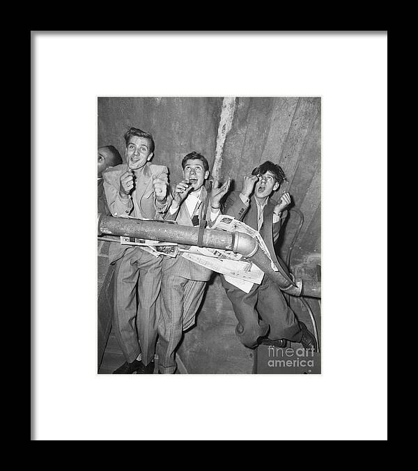 Young Men Framed Print featuring the photograph Baseball Fans Clinging To Pipes by Bettmann