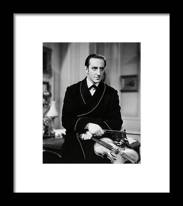 Basil Rathbone Framed Print featuring the photograph BASIL RATHBONE in THE HOUND OF THE BASKERVILLES -1939-. by Album