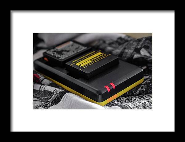 Battery Framed Print featuring the photograph Battery charger for mirrorless and reflex cameras by Luca Lorenzelli