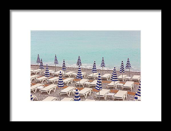 Beach Umbrellas In Nice Framed Print featuring the photograph Beach Umbrellas in Nice by Melanie Alexandra Price
