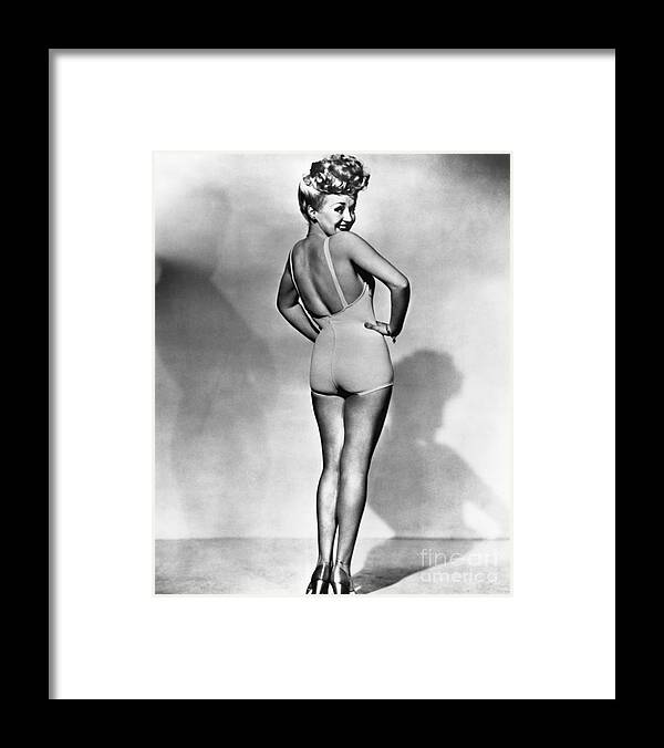 People Framed Print featuring the photograph Betty Grable Bathing Suit Pinup, Ca by Bettmann