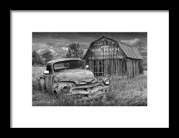 Chevy Framed Print featuring the photograph Black and White of Rusted Chevy Pickup Truck in a Rural Landscape by a Mail Pouch Tobacco Barn by Randall Nyhof