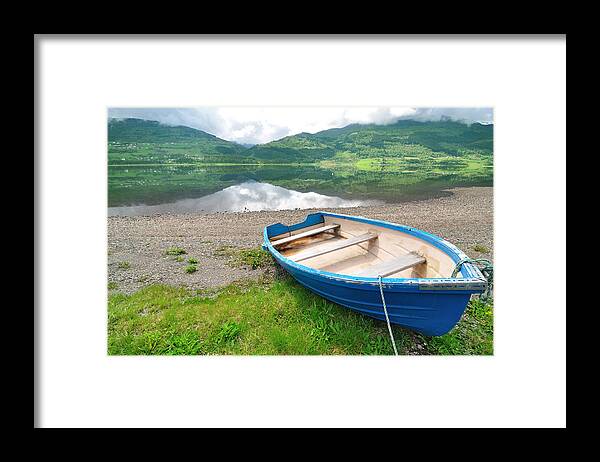Water's Edge Framed Print featuring the photograph Boat On The Shore With Calm Lake And by R9 ronaldo