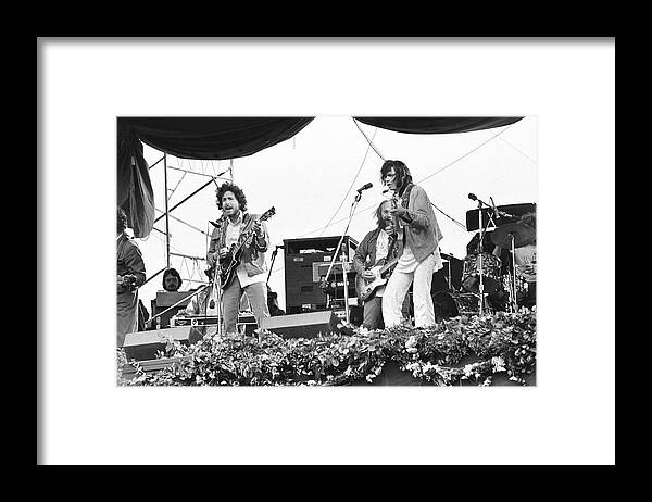 Charity Benefit Framed Print featuring the photograph Bob Dylan & Neil Young Performing At by Richard Mccaffrey