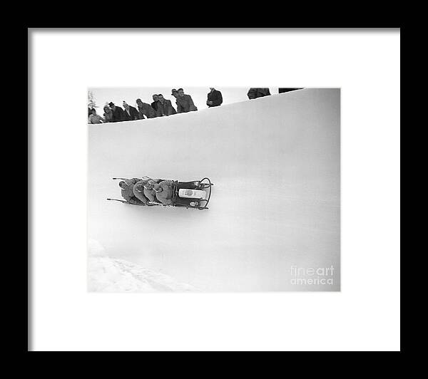The Olympic Games Framed Print featuring the photograph Bobsled Team Racing On Course by Bettmann