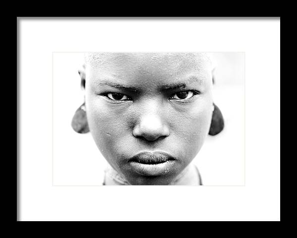 Child Framed Print featuring the photograph Bodi Tribe In Ethiopia On October 27 by Eric Lafforgue