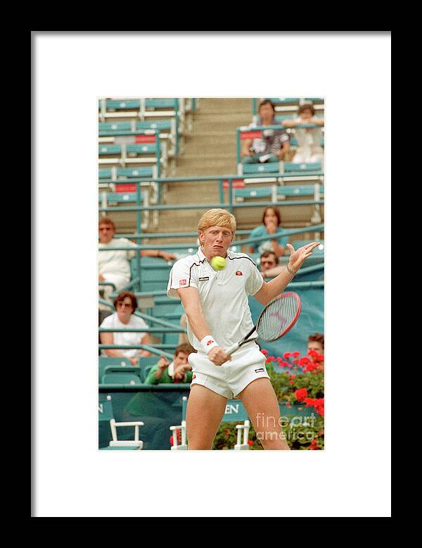 1980-1989 Framed Print featuring the photograph Boris Becker Swings At Tennis Ball by Bettmann