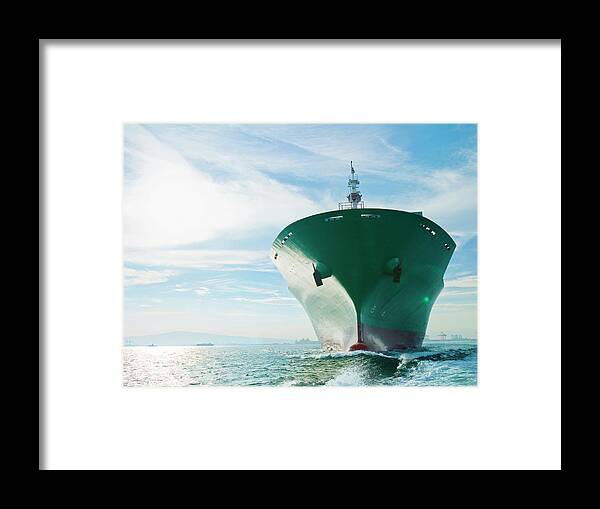 Trading Framed Print featuring the photograph Bow View Of Cargo Ship Sailing On Ocean by Stewart Sutton