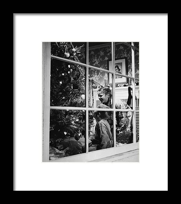 Child Framed Print featuring the photograph Boy And Girl 3-8 Looking At Christmas by Fpg