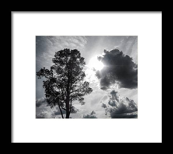 Black & White Framed Print featuring the photograph Breaking Through the Clouds by Michael Frank