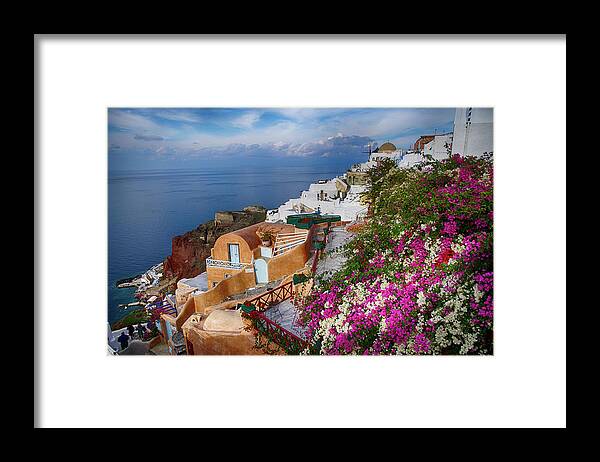 Greek Framed Print featuring the photograph Bright colored flowers spill over the walls by Steve Estvanik