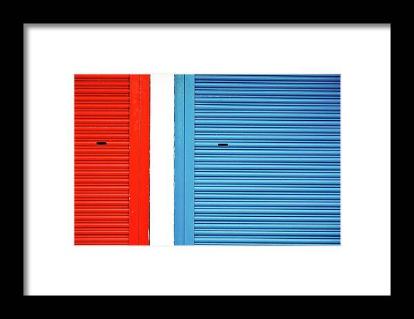Outdoors Framed Print featuring the photograph Bright Red And Blue Roller Shutters by M. Ivkovic - Bangphoto.co.uk