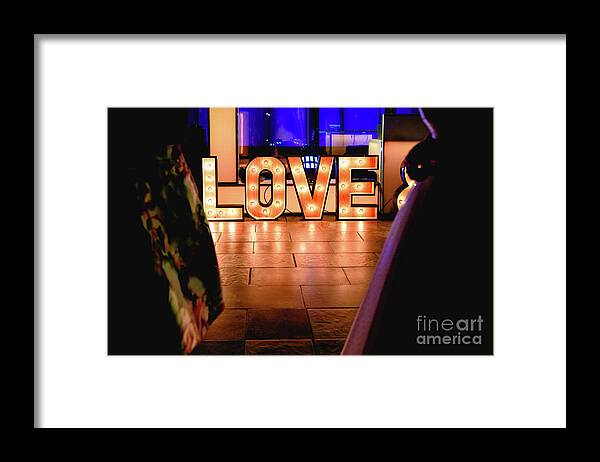 Bright Framed Print featuring the photograph Bright wooden letters with word Love in a party by Joaquin Corbalan