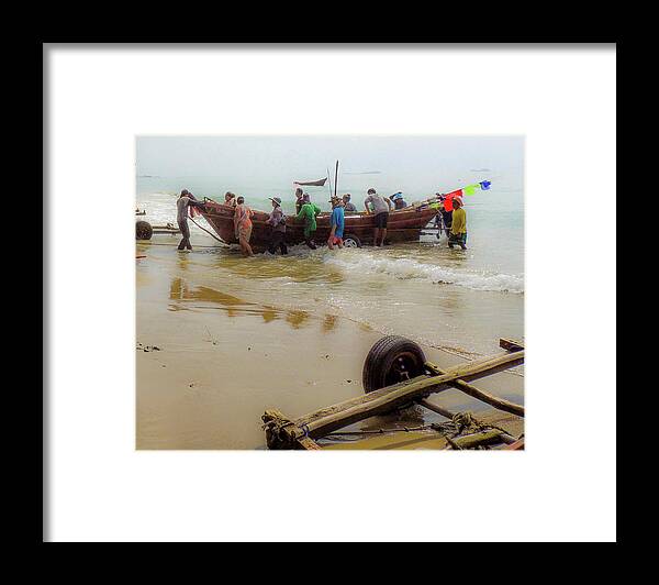 Beach Framed Print featuring the photograph Bringing in the catch by Jeremy Holton