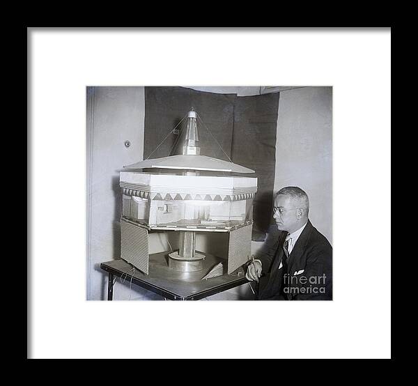 Hanging Framed Print featuring the photograph Buckminster Fuller With Dymaxion House by Bettmann