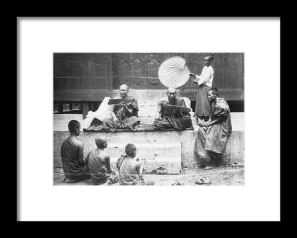 Education Framed Print featuring the photograph Buddhist Monks Teaching Law From Palm by Bettmann
