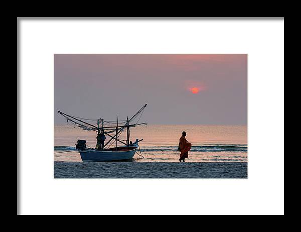Water's Edge Framed Print featuring the photograph Buddhist Monks Walk At The Beach by Monthon Wa